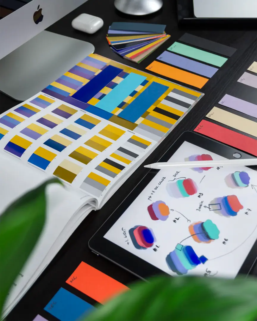 Printed brand identity materials laid out on a work table